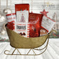 Golden sled, filled with red and white packaged chocolates