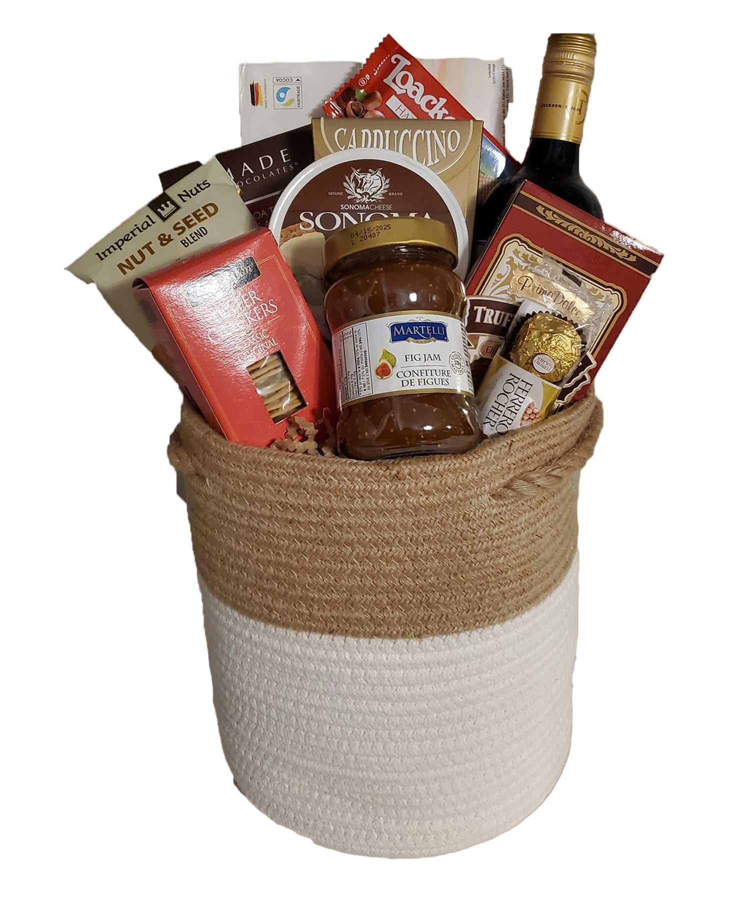 Wicker basket full of wine, cheese and treats